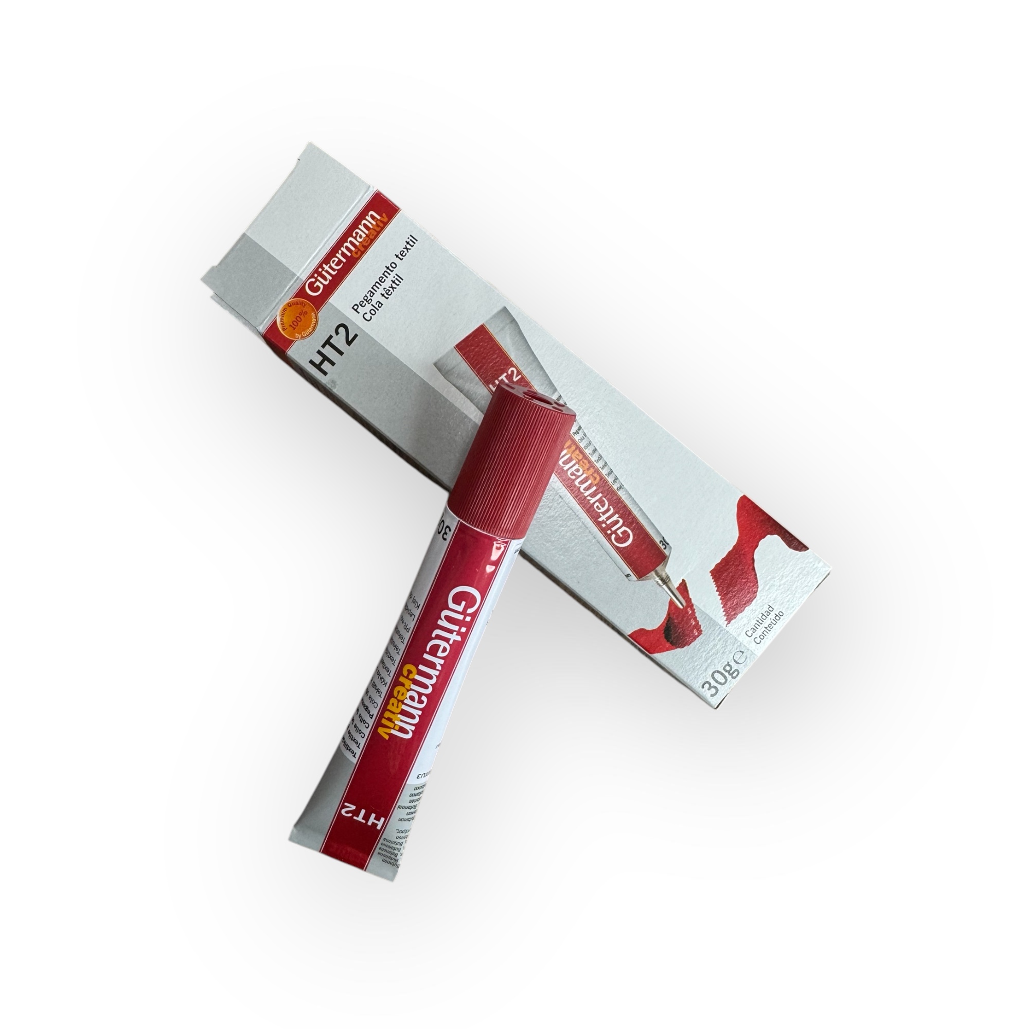 Pegamento Textil Gütermann HT2 de 30g con envase frontal visible, ideal para manualidades y reparaciones textiles.