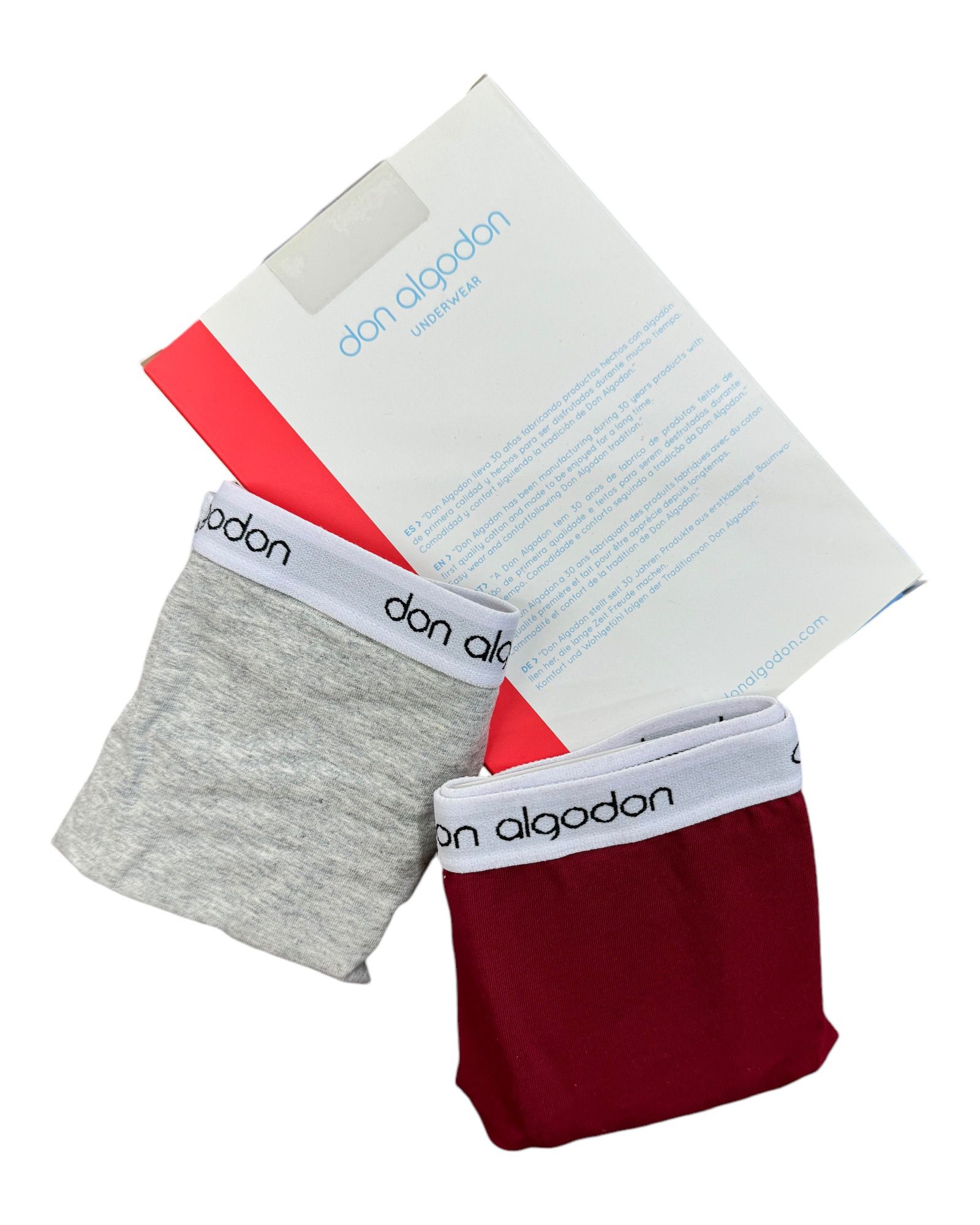 Pack de 2 boxers Don Algodón en colores gris y rojo, con el empaque en fondo.